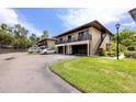 This well-maintained condo has a private balcony and a dedicated parking area near landscaped areas at 1881 Lichen Ln # B, Clearwater, FL 33760