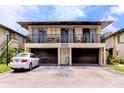 Two story exterior of condo with balconies and garage at 1881 Lichen Ln # B, Clearwater, FL 33760