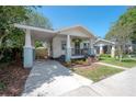 Attractive single Gathering home with a covered parking area and a welcoming front porch at 318 W Haya St, Tampa, FL 33603
