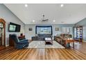 Spacious living room with hardwood floors, neutral walls, ceiling fan, and comfortable seating arrangements at 4123 Daisy Dr, Hernando Beach, FL 34607