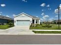 Charming single-story home with a well-maintained lawn and a two-car garage at 4510 Big Woods Way, Parrish, FL 34219