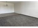 Spacious living room featuring tiled flooring and carpet in different sections with overhead lighting at 750 Island Way # 101, Clearwater Beach, FL 33767