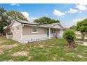 Charming single-story home featuring a well-maintained lawn with beautiful landscaping at 7901 Marlboro Dr, Port Richey, FL 34668