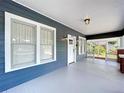 Charming front porch showcasing a bright entrance door and classic architectural details for added curb appeal at 1019 E Mohawk Ave, Tampa, FL 33604