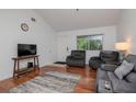 Cozy living room with hardwood floors, a large window, comfortable seating, and a neutral color scheme creating a relaxing atmosphere at 10265 Gandy N Blvd # 1702, St Petersburg, FL 33702