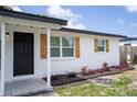 Close up of the entrance of this home, with nice landscaping and new shutters at 10408 118Th Ave, Largo, FL 33773