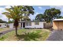 This home has a well-maintained lawn and new pavement at 10408 118Th Ave, Largo, FL 33773