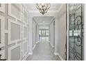 Grand foyer showcasing decorative wall trim, high ceilings, and an inviting open layout at 1902 Marshberry Ct, New Port Richey, FL 34655