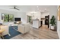 Bright living room features modern furniture, open layout, and sleek finishes at 2171 Portofino Pl # 27-2725, Palm Harbor, FL 34683