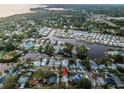 Scenic aerial perspective of the neighborhood's canal-lined streets and waterfront community at 224 Georgia Ave, Crystal Beach, FL 34681