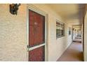 Exterior view of the property's front door, showcasing the building's structure and unit location at 2460 Northside Dr # 802, Clearwater, FL 33761