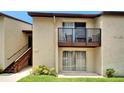 Well-maintained condo exterior boasting private balcony and convenient access to ground floor entrance at 4215 E Bay Dr # 1801E, Clearwater, FL 33764
