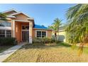Beautiful single Gathering home with manicured lawn and mature palm trees, offers great curb appeal at 7705 Nottinghill Sky Dr, Apollo Beach, FL 33572