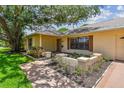 Charming home featuring manicured flower beds, beautiful exterior brickwork, and inviting landscaping at 1443 54Th Ne Ave, St Petersburg, FL 33703