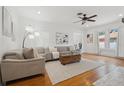 Cozy living room featuring hardwood floors, a comfortable seating arrangement, and abundant natural light at 1650 22Nd N Ave, St Petersburg, FL 33713