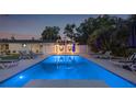 Inviting pool featuring an adjacent seating area and lush landscaping, perfect for summer days and relaxing evenings at 1650 22Nd N Ave, St Petersburg, FL 33713