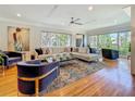 Spacious living room features hardwood floors, a large sectional, and abundant natural light at 301 23Rd Ne Ave, St Petersburg, FL 33704