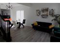 Bright living space with modern decor, hardwood floors, and a view of the open dining area at 3512 Osprey Cove Dr, Riverview, FL 33578