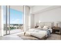Bright bedroom featuring a plush bed, balcony access, and scenic views of the city at 400 Central Ave # 808, St Petersburg, FL 33701