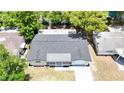 Aerial view of the home's roof, driveway and surrounding trees at 4638 Durney St, New Port Richey, FL 34652