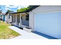 Close up of the exterior of a charming single-story home with a one car garage at 4638 Durney St, New Port Richey, FL 34652