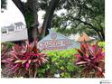 Community sign view of Charter Mill Condominiums with lush landscaping at 5203 Oak Charter Ct # 5203, Temple Terrace, FL 33617