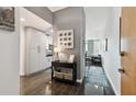 Welcoming entryway with dark floors, gray walls, and decor leading to an open living area at 777 N Ashley Dr # 2510, Tampa, FL 33602
