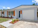 Well-maintained home featuring an attached garage, fresh exterior paint, and updated landscaping at 1213 W Camellia Dr, Brandon, FL 33510