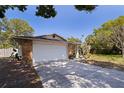 A large two-car garage provides ample parking and storage at this charming ranch style home at 201 Westwood N Ter, St Petersburg, FL 33710