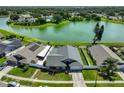 Aerial view showing house location, lake view, fencing, and lush backyard at 2021 Elk Spring Dr, Brandon, FL 33511