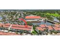 Aerial view of townhomes near a waterway with boat slips and easy access to nearby amenities at 2363 Hanover Dr, Dunedin, FL 34698