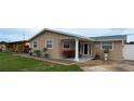 Inviting single-story home featuring a quaint porch and manicured front yard at 4403 W Minnehaha St, Tampa, FL 33614
