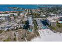 Aerial view shows condo, beach access, beach amenities and gulf views at 4510 Gulf Blvd # 604, St Pete Beach, FL 33706