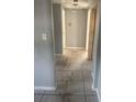 Tile hallway leading to multiple rooms within the house at 5211 E 17Th Ave, Tampa, FL 33619