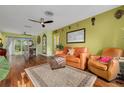 Spacious living room with hardwood floors and adjacent dining area at 5700 Pacific N St, St Petersburg, FL 33703