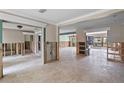 Spacious living room with tile floors, open concept design, and a neutral color palette perfect for customization at 648 Geneva Pl, Tampa, FL 33606