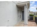 View of front door, with neutral paint, and exterior storage closet at 10966 Winter Crest Dr, Riverview, FL 33569