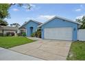 Lovely single-Gathering home boasts lush landscaping and a two-car garage for ample parking at 12546 108Th St, Largo, FL 33778