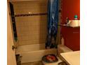 The bathroom features a shower and tub with a tiled surround at 12709 Greenland Dr, Riverview, FL 33579