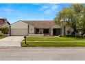 Inviting single Gathering home with a well maintained lawn, trimmed hedges, and a mailbox at 14164 Fennsbury Dr, Tampa, FL 33624