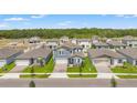 Overhead view of the home showcasing its position in a well-planned neighborhood with lush greenery at 1829 Draughton Dr, Zephyrhills, FL 33541