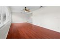 Bright and airy living room with hardwood floors, neutral paint and abundant natural light at 3839 18Th N Ave, St Petersburg, FL 33713