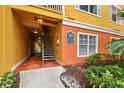 Exterior of a building entrance with stairs leading to units, lush landscaping, and well-maintained grounds at 4207 S Dale Mabry Hwy # 2105, Tampa, FL 33611