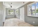 Bright sun room featuring neutral walls, tiled flooring, and plenty of natural light from multiple windows at 535 6Th N St, St Petersburg, FL 33701
