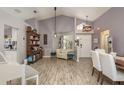 Open-concept living room with vaulted ceilings, modern lighting, and stylish furnishings at 5826 Taywood Dr, Tampa, FL 33624