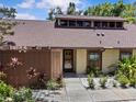 Inviting home featuring a private fenced courtyard and beautiful mature landscaping at 7705 4Th W Ave, Bradenton, FL 34209