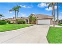 Well-maintained single-story home with a spacious driveway and manicured front yard landscaping at 8521 30Th E St, Parrish, FL 34219