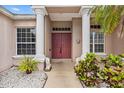 Elegant front entrance with stately columns, double doors, and decorative lion statues at 8521 30Th E St, Parrish, FL 34219