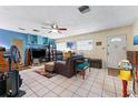 Inviting living room with bright tile flooring, ample natural light, and open layout at 9602 N Rome Ave, Tampa, FL 33612