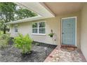 Inviting front porch with decorative tile and landscaping at 10614 Hudson Ave, Hudson, FL 34669